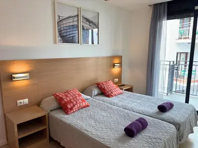 Cama o camas de una habitación en Bali Suite - Modern Apartment with Parking & Swimming Pool