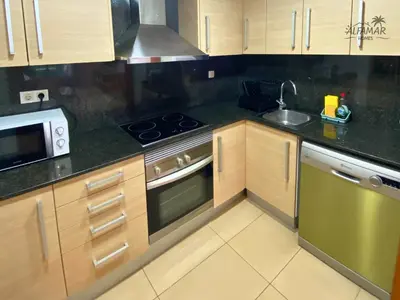 Una cocina o zona de cocina en Bali Suite - Modern Apartment with Parking & Swimming Pool