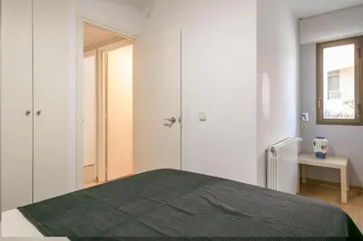 Cama o camas de una habitación en Piso familiar con piscina frente al mar