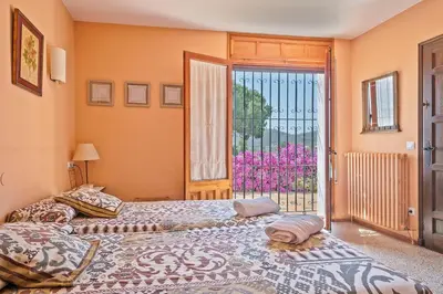 Cama o camas de una habitación en Winahost Villa Avenida Països Catalans