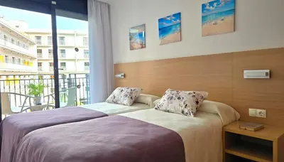 Cama o camas de una habitación en NEXTHOME Town Center & Pool