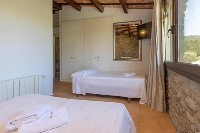 Cama o camas de una habitación en casa rural de ensueño