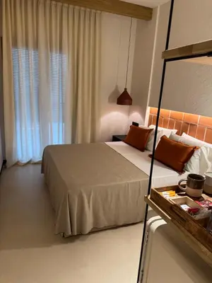 Cama o camas de una habitación en BELLADORA Hotel Boutique
