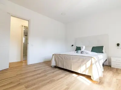 Cama o camas de una habitación en Villa Winahost Sant Cosme con piscina privada