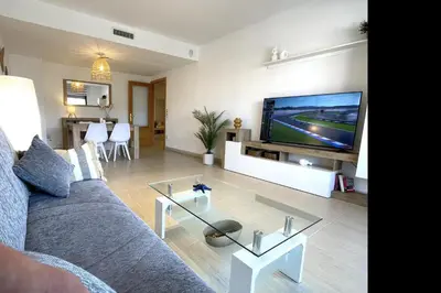 Una televisión o centro de entretenimiento en LETS HOLIDAYS Nice apartment near beach Tossa 2