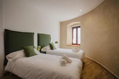 Cama o camas de una habitación en Torre dels Bous Apartaments