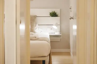 Cama o camas de una habitación en Bravissimo Pedret, Barri Vell apartment