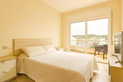 Cama o camas de una habitación en Apartamento Familiar en Fenals, Santa Clotilde