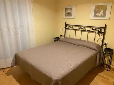 Cama o camas de una habitación en Acogedor