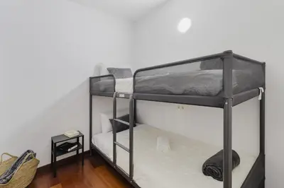 Cama o camas de una habitación en Apartamento Carlemany con tres habitaciones dobles