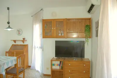 Una televisión o centro de entretenimiento en Apartamento Jazmín