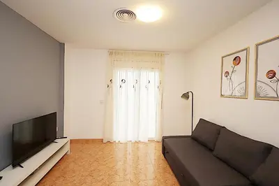 Una televisión o centro de entretenimiento en Apartamento Tahiti
