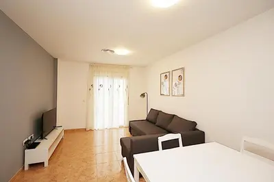 Una televisión o centro de entretenimiento en Apartamento Tahiti