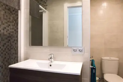 Un baño de SeaHomes Vacations - Seafront Apt Fenals & PKG