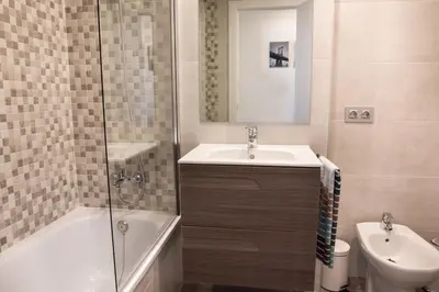 Un baño de SeaHomes Vacations - Seafront Apt Fenals & PKG