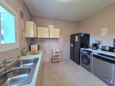 Una cocina o zona de cocina en Villa Begonia