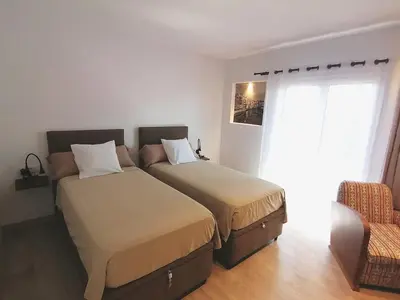 Cama o camas de una habitación en Central 2 bedroom apartment with terrace