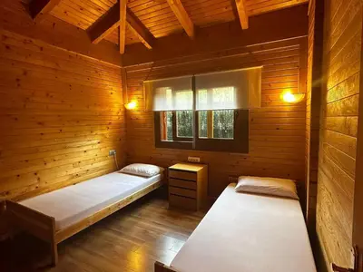 Cama o camas de una habitación en Villa Wood Dreams – Villa de madera en Calonge, con jacuzzi y piscina privada - ES-209-95