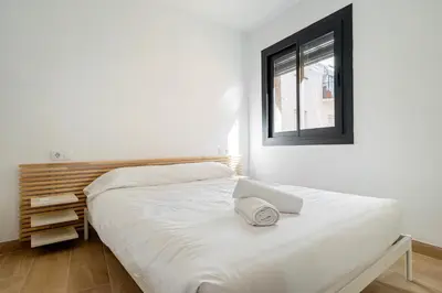 Cama o camas de una habitación en Hauzify I Casa El Rebost