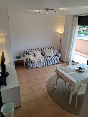 Zona de estar de Fenals Beach Penthouse