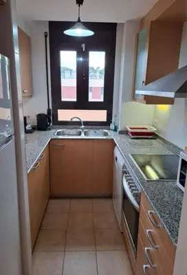 Una cocina o zona de cocina en Fenals Beach Penthouse