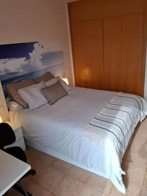 Cama o camas de una habitación en Fenals Beach Penthouse