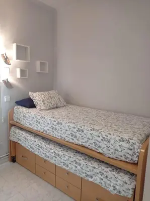 Cama o camas de una habitación en Casa con plaza de parking