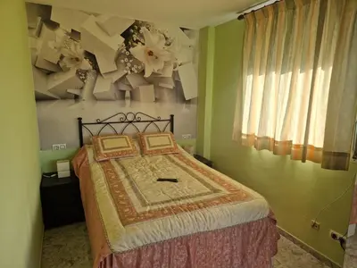Cama o camas de una habitación en Acogedor apartamento a tres minutos de la playa