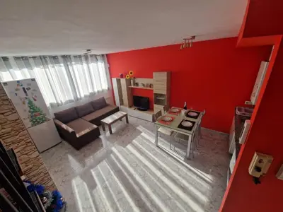 Zona de estar de Acogedor apartamento a tres minutos de la playa