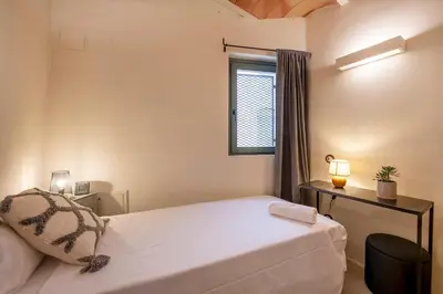 Cama o camas de una habitación en Luxurious Barri Vell House - Heart of the Old Town