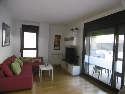 Una televisión o centro de entretenimiento en Amplio apartamento con piscina y aire acondionado
