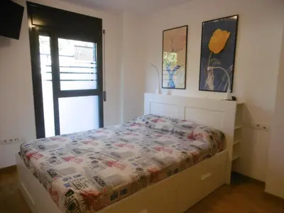 Cama o camas de una habitación en Amplio apartamento con piscina y aire acondionado
