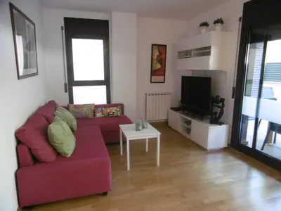 Una televisión o centro de entretenimiento en Amplio apartamento con piscina y aire acondionado