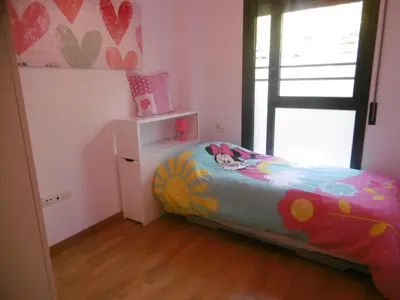 Cama o camas de una habitación en Amplio apartamento con piscina y aire acondionado