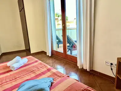 Cama o camas de una habitación en EVH123 Casa adosada con piscina comunitaria