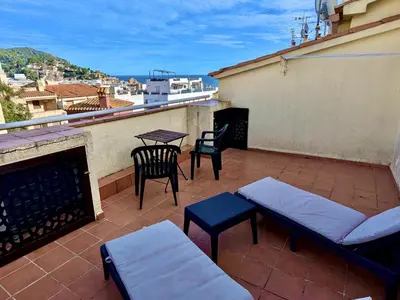 Un balcón o terraza de EVH123 Casa adosada con piscina comunitaria