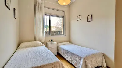 Cama o camas de una habitación en EVH127 Bajo con terraza y piscina comunitaria