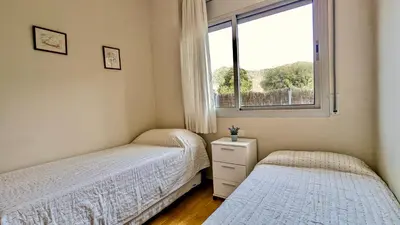 Cama o camas de una habitación en EVH127 Bajo con terraza y piscina comunitaria
