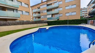 Piscina en o cerca de EVH127 Bajo con terraza y piscina comunitaria