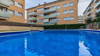 Piscina en o cerca de EVH127 Bajo con terraza y piscina comunitaria