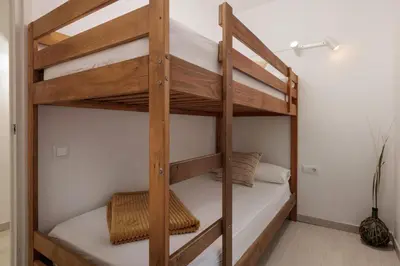 Cama o camas de una habitación en LETS HOLIDAYS Beach Apartment in Tossa