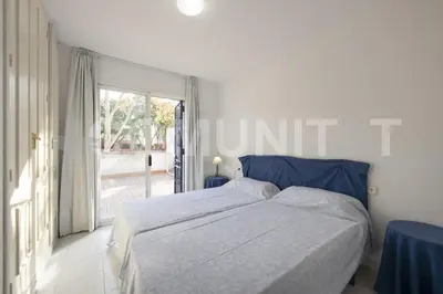 Cama o camas de una habitación en Apartamento con piscina y aparcamiento en Playa de Aro