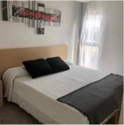 Cama o camas de una habitación en VILLAS COSETTE Apartamento NEPTUNO 417