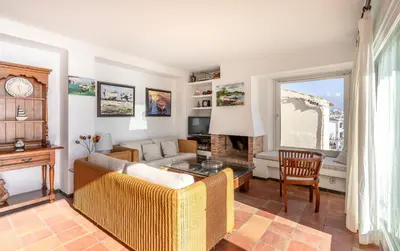Una televisión o centro de entretenimiento en Apartamento La Vela con Vistas al Mar - WeHost Costa Brava