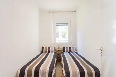 Cama o camas de una habitación en Apartment with garden and sea view Santa Cristina Blanes