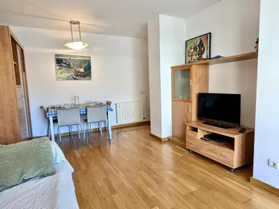 Una televisión o centro de entretenimiento en EVH135 Apartamento con piscina comunitaria