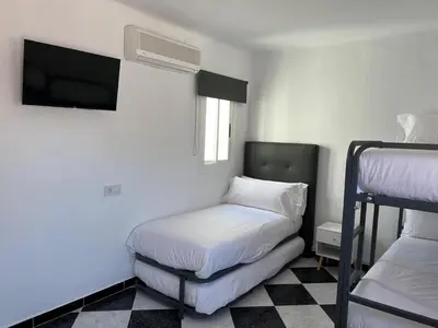 Cama o camas de una habitación en Seahomes Vacations - CentralVillage House at Beach