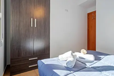 Cama o camas de una habitación en Hauzify I Apartament Fenals