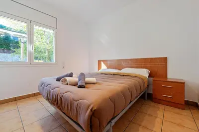 Cama o camas de una habitación en Hauzify I Apartament Fenals