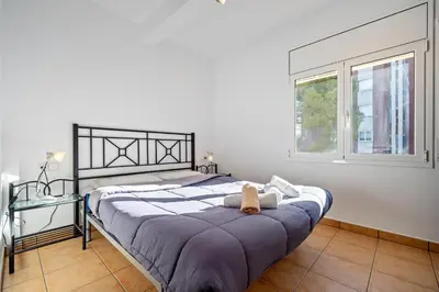 Cama o camas de una habitación en Hauzify I Apartament Fenals
